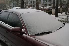 What should we do if the car glass is frosted or even frozen in cold weather